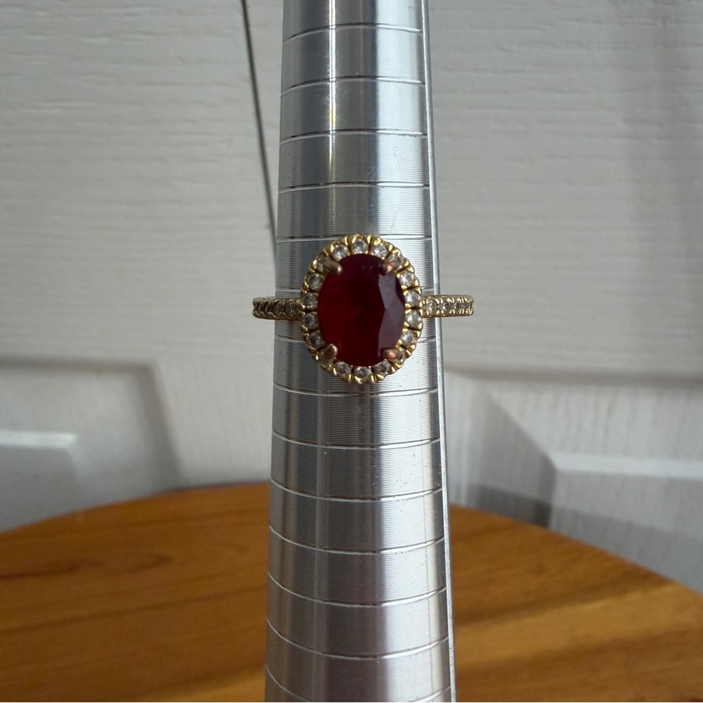 Gold Ring with Deep Red Oval Stone and Halo